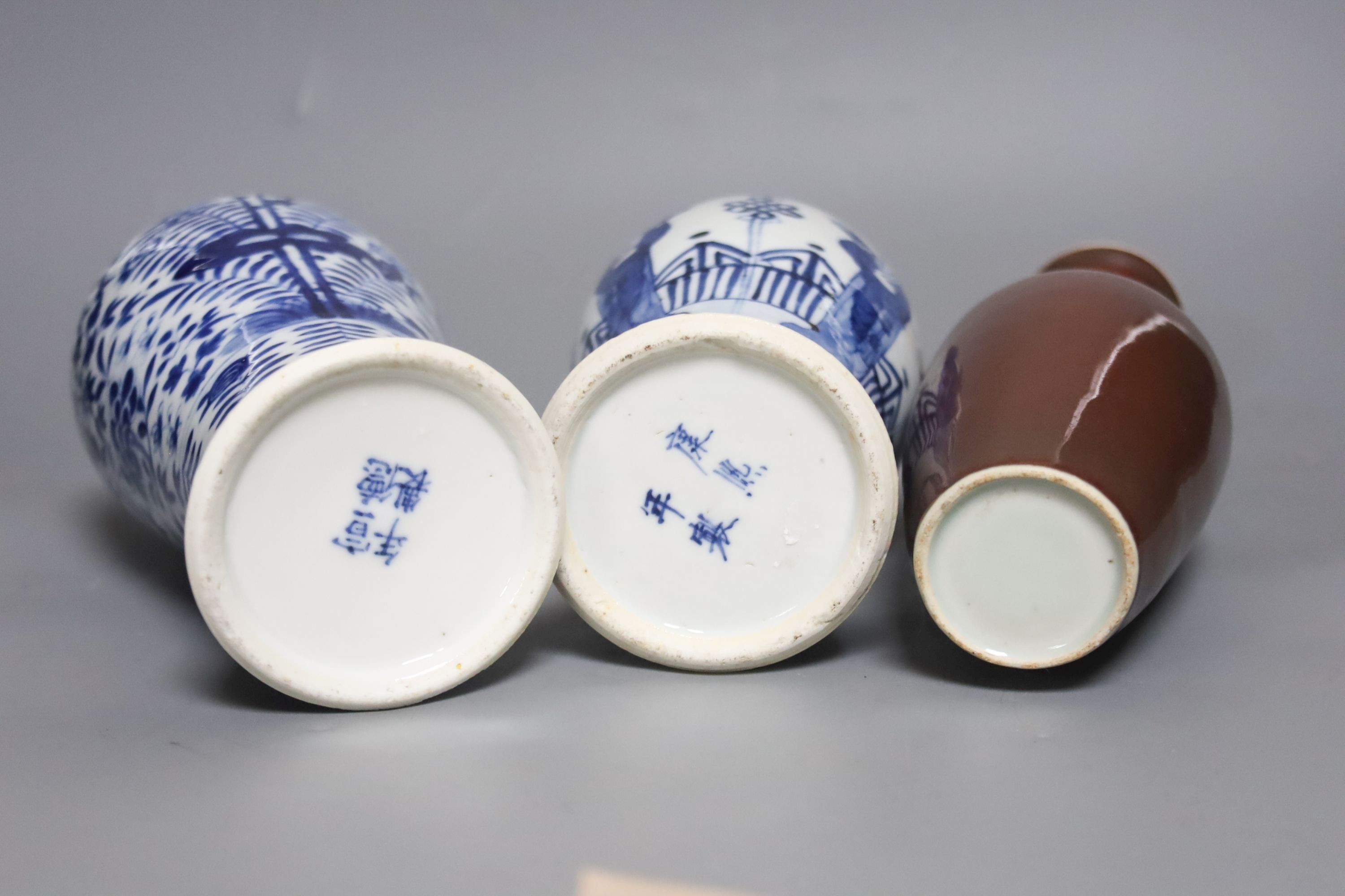 Two Chinese blue and white baluster vases, late 19th century and a Chinese sang de boeuf glazed vase, 27cm